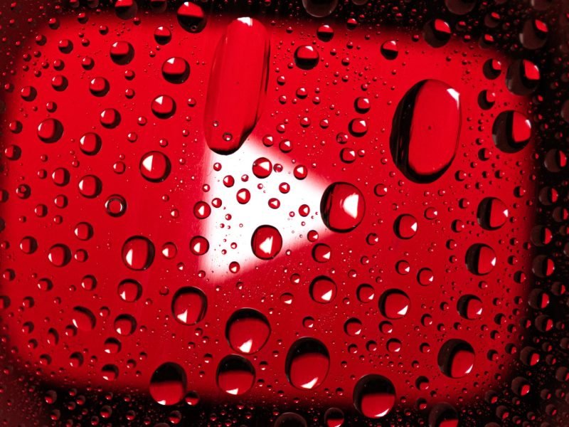 water droplets on red surface